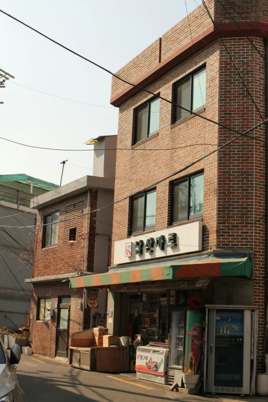 a po of a brick building with a awning