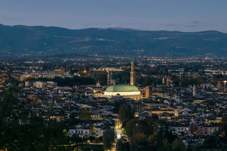 an urban city with hills in the background