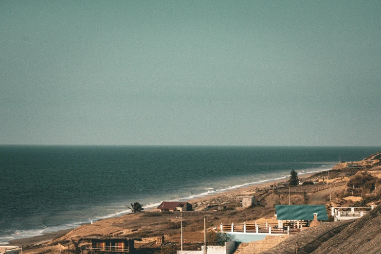 a beach with a boat in the ocean