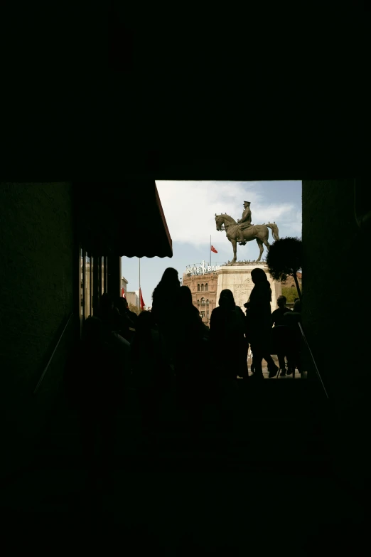 people stand on the stairs in front of a church