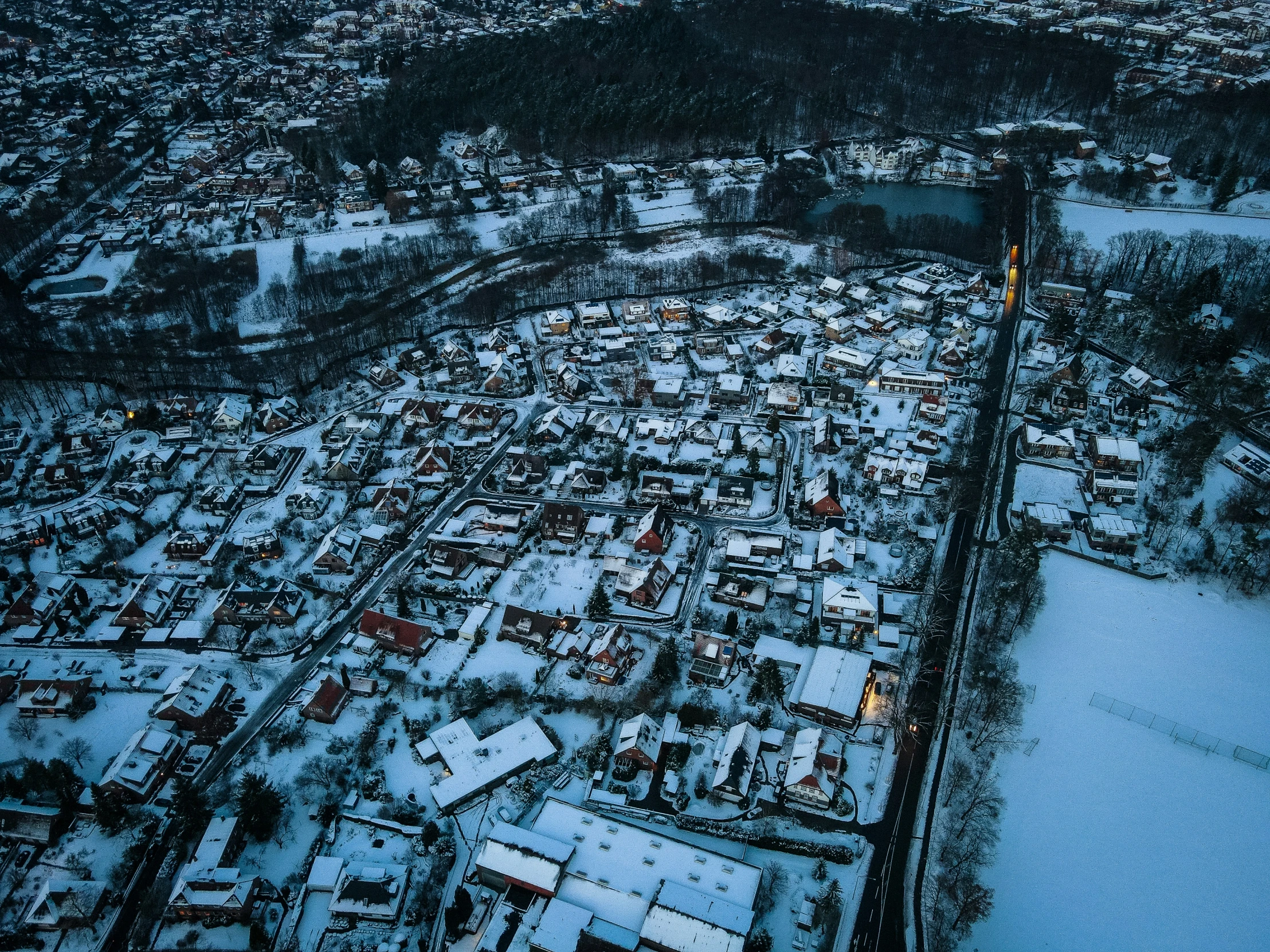 an aerial view of a city on a snowy day