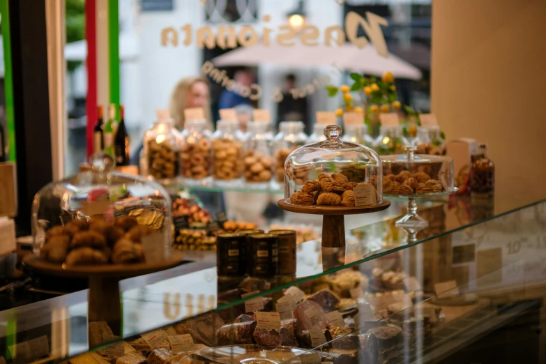 a display in a store with many different kinds of desserts