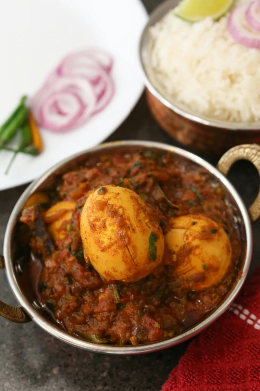 a pot of stew with rice and meat in it