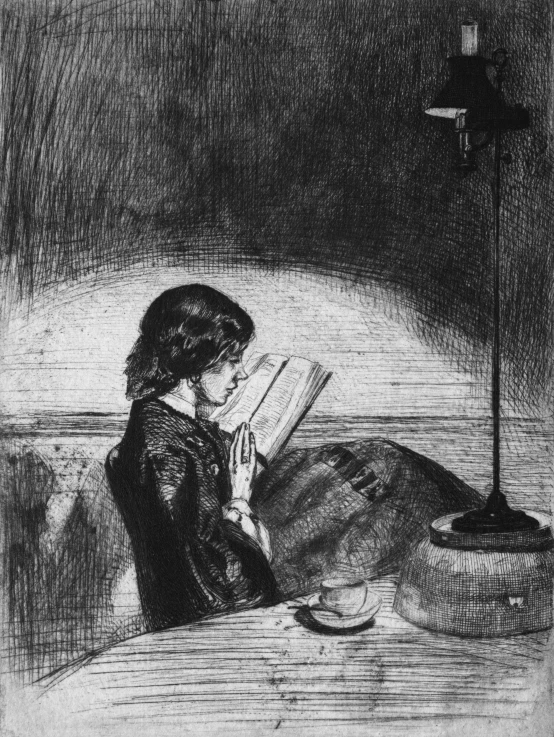 a girl reads a book while sitting on the floor