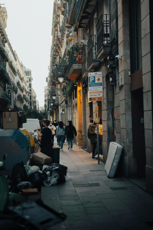 the back street is littered with suitcases and clothing