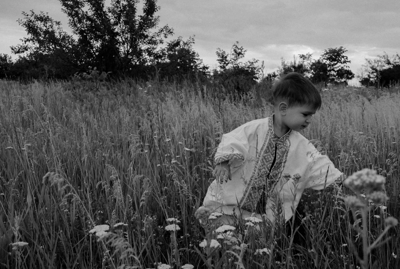 black and white pograph of  in field of wildflowers