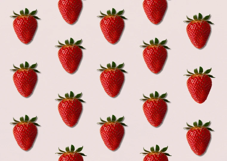 several red strawberries are standing next to each other