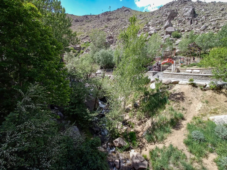 the view of an outdoor bridge near a hill