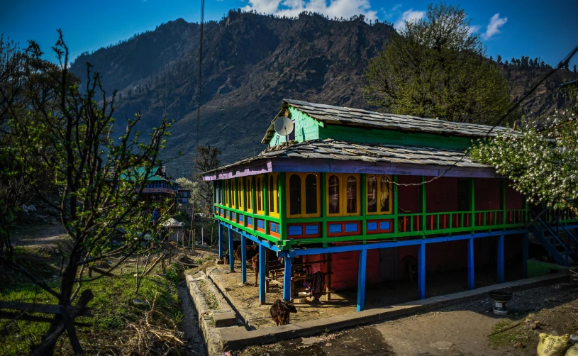 a colorful building on the side of a road