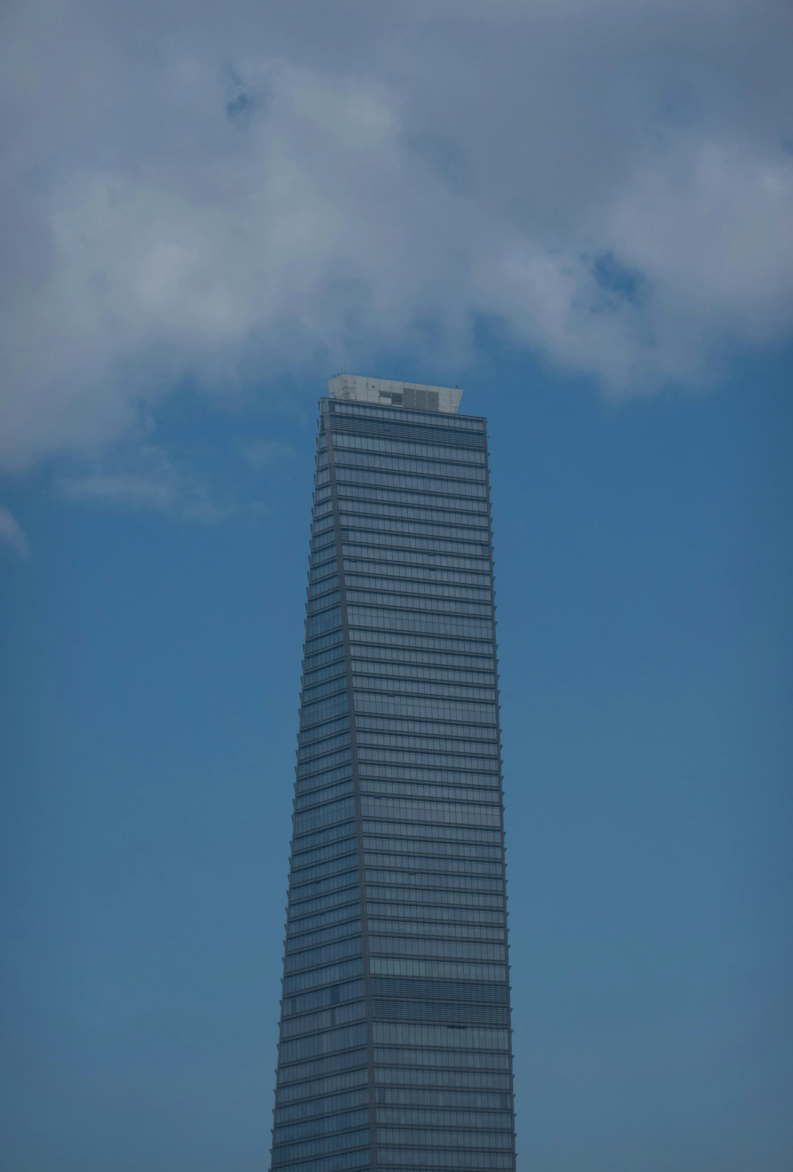 a very tall building with a very long street in front of it