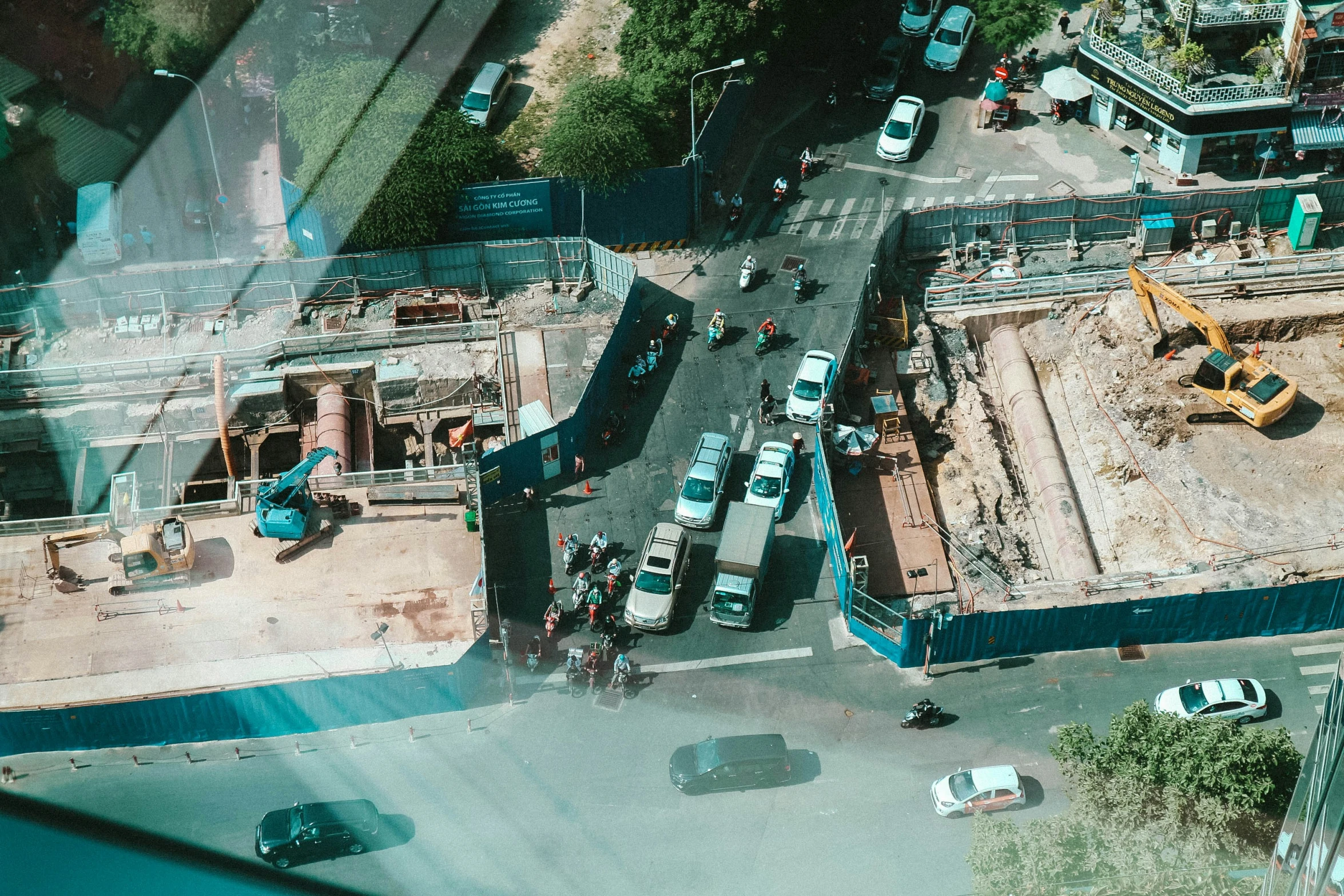 looking down on construction sites in the middle of a city