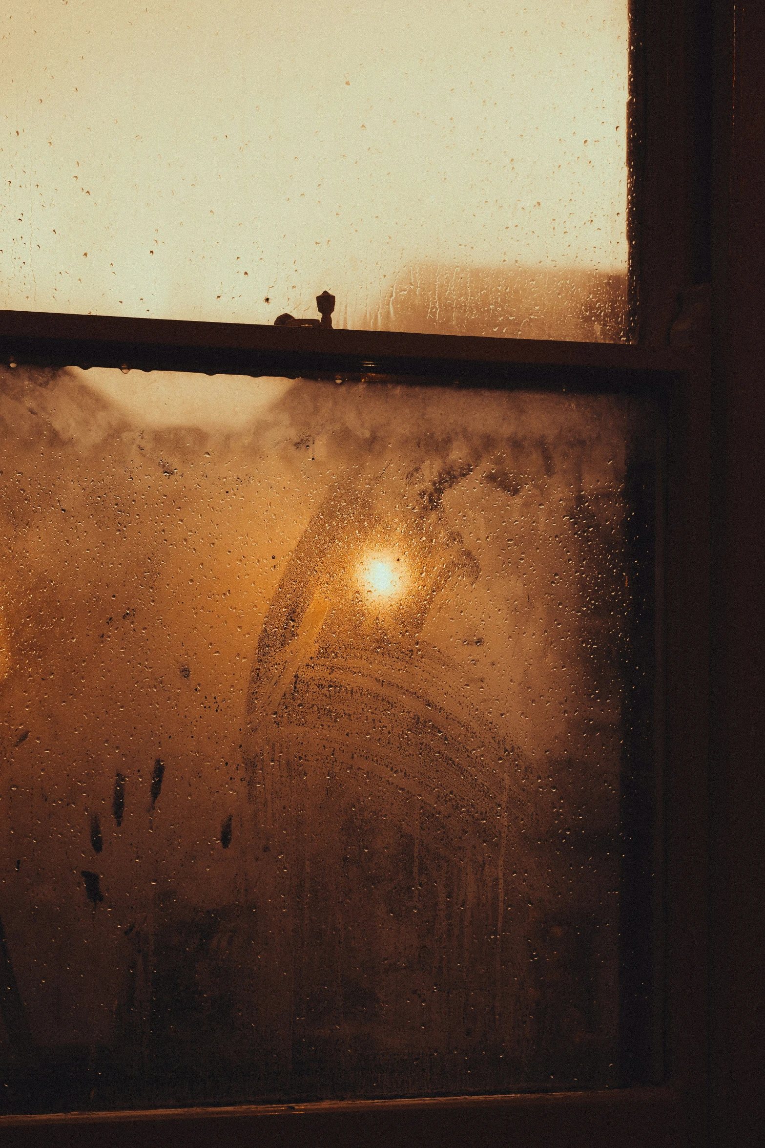 a very dirty window sill with a light inside