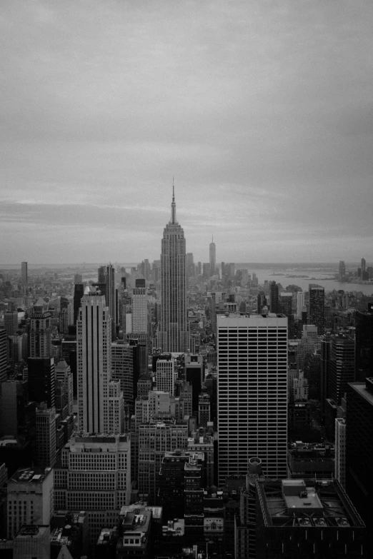 a black and white po shows a city with tall buildings