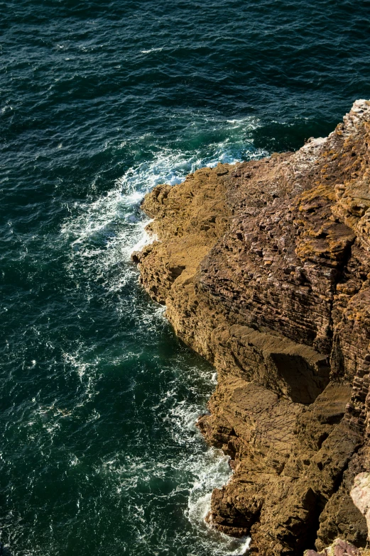 a couple of rocks that have some water on top of it