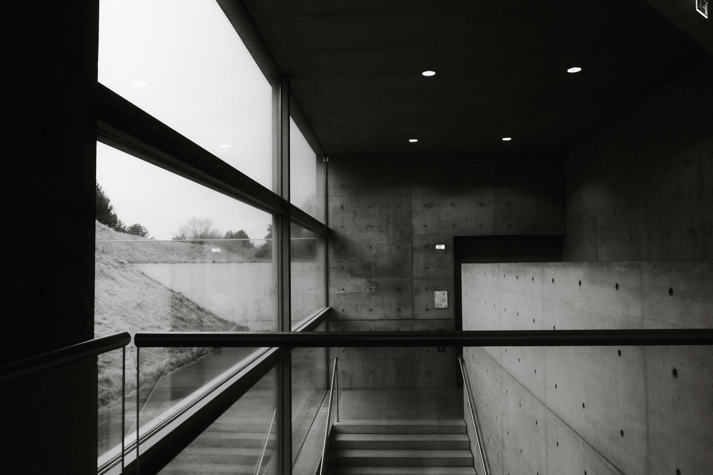 an empty stairway has been darkened by fog