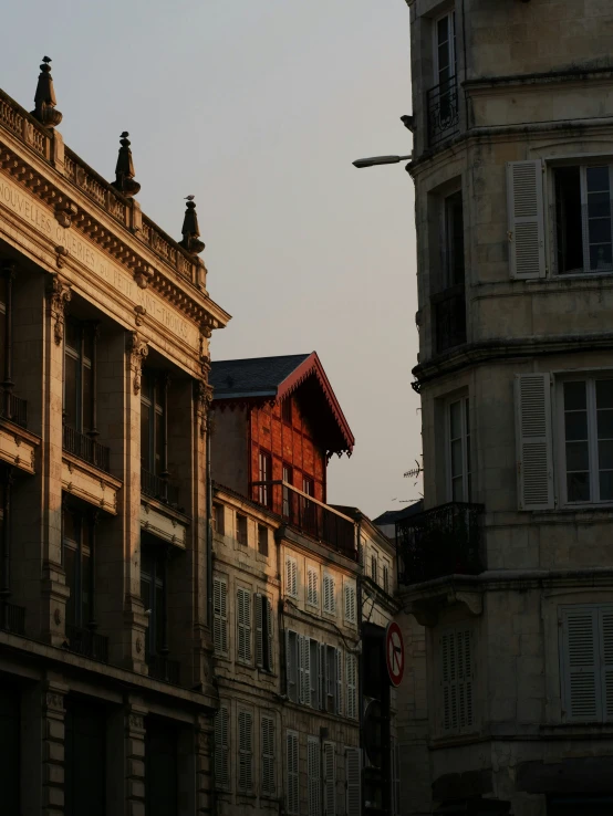 the buildings next to each other has a clock on the front