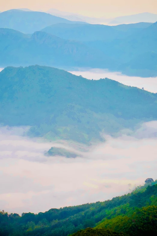 mist rising on the mountains, surrounded by hills