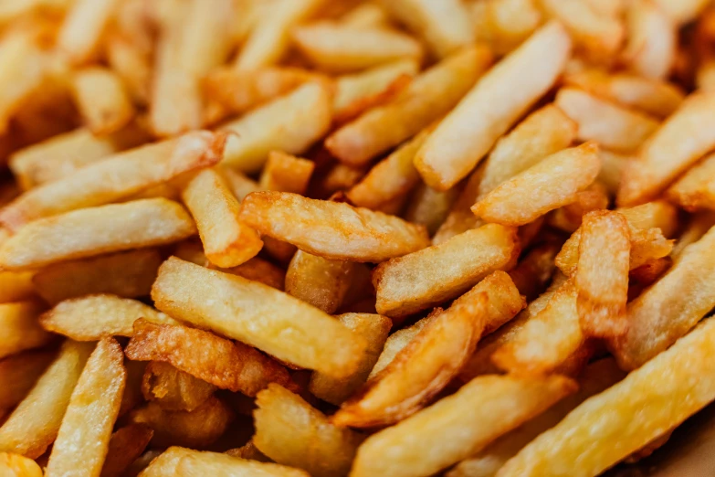 a close up s of french fries on a table