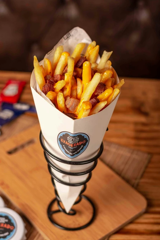 a container with fries sits on a tray