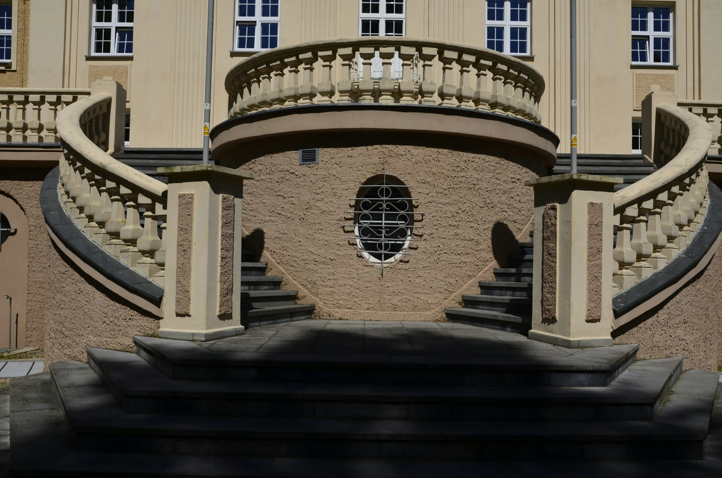 the building has several balconies with windows on it