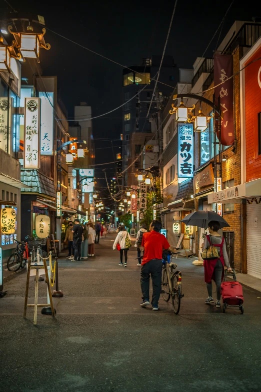 people walking down the street in a city