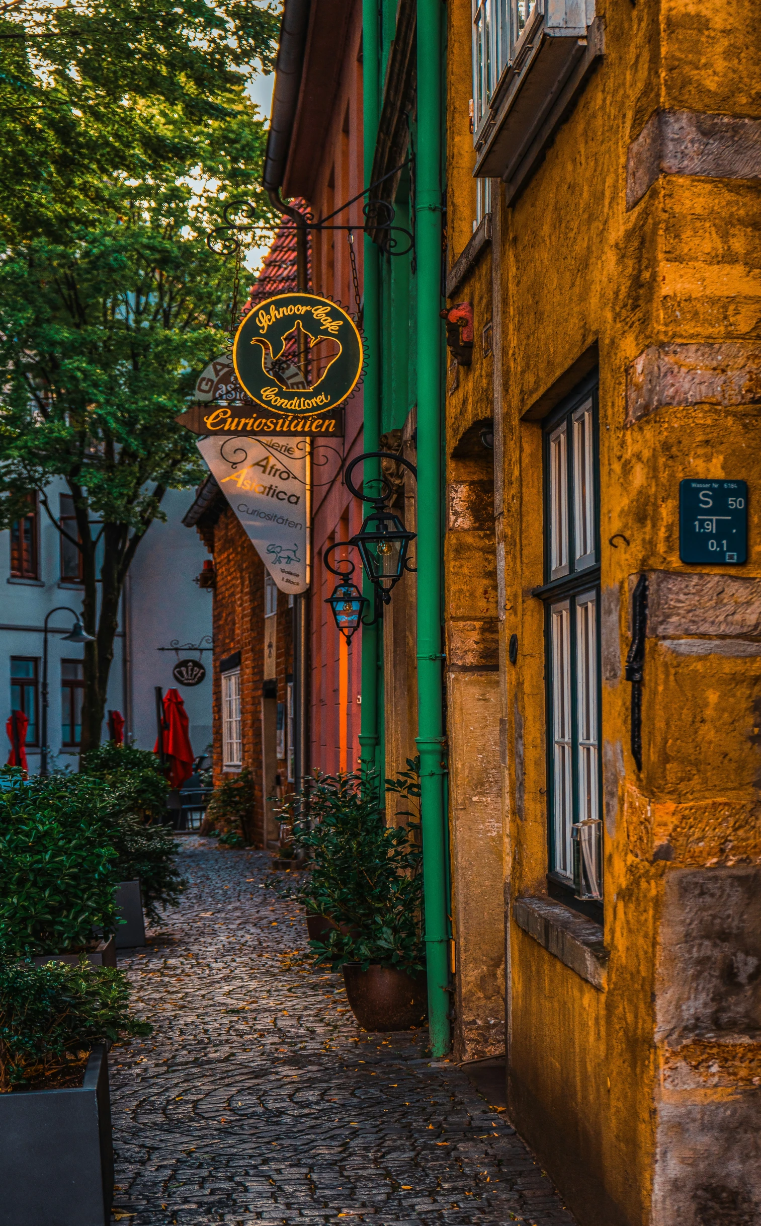 a city street with people sitting on the curb