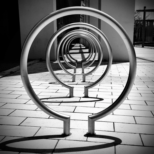 a metal object on the ground in front of a building