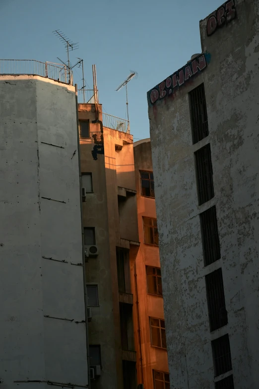 some tall building that have signs on top