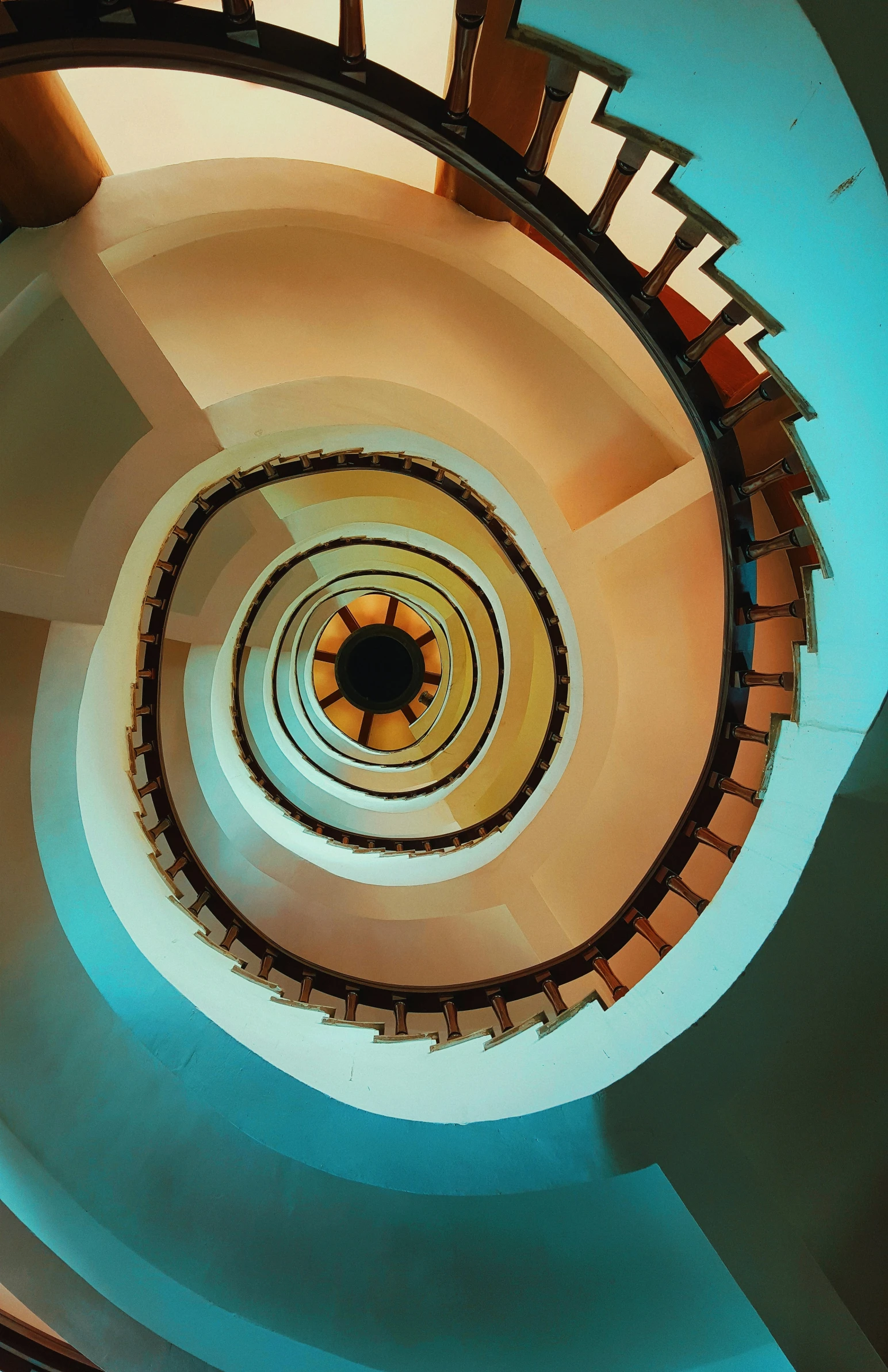 an overhead s shows the top of a spiral staircase