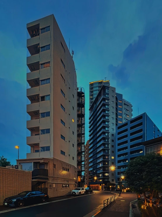 a couple of tall buildings in a large city