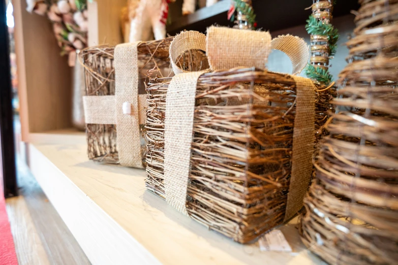 some decorative baskets are sitting on a mantle