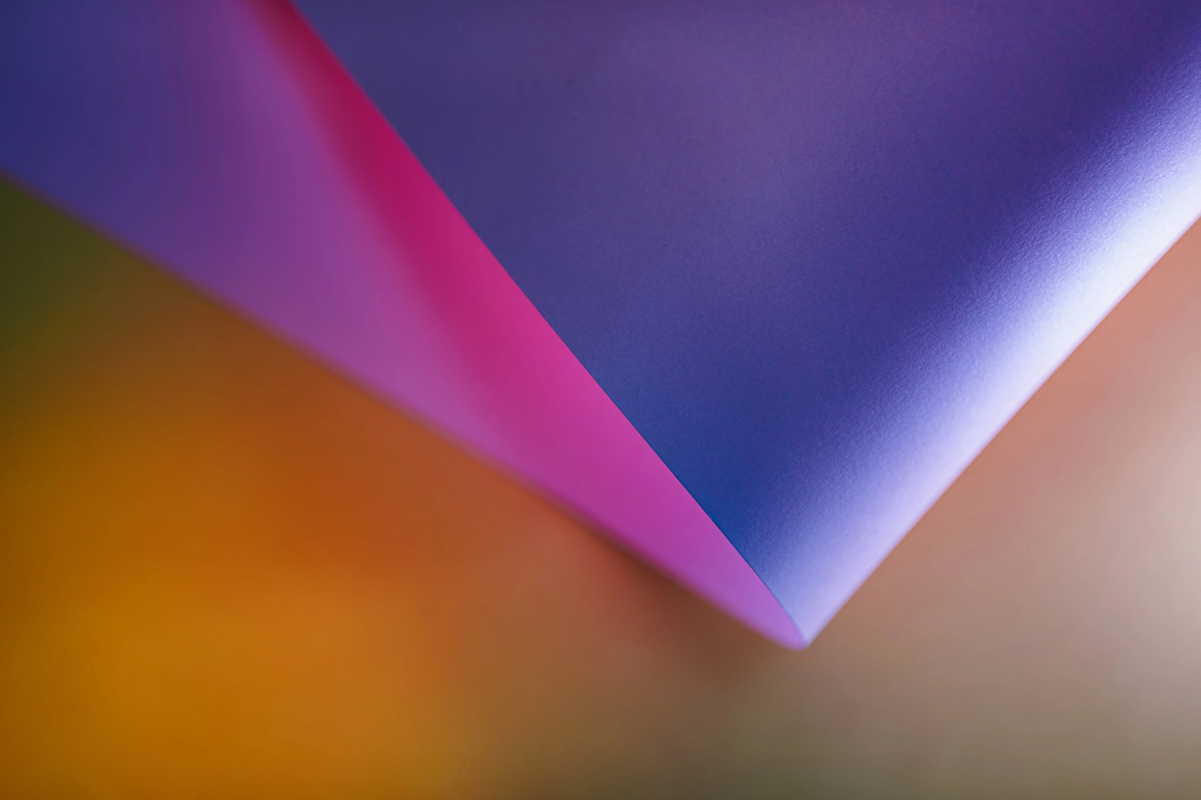 a group of multicolored paper on a table