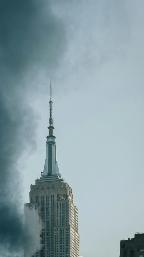 a tall building sitting under a stormy sky