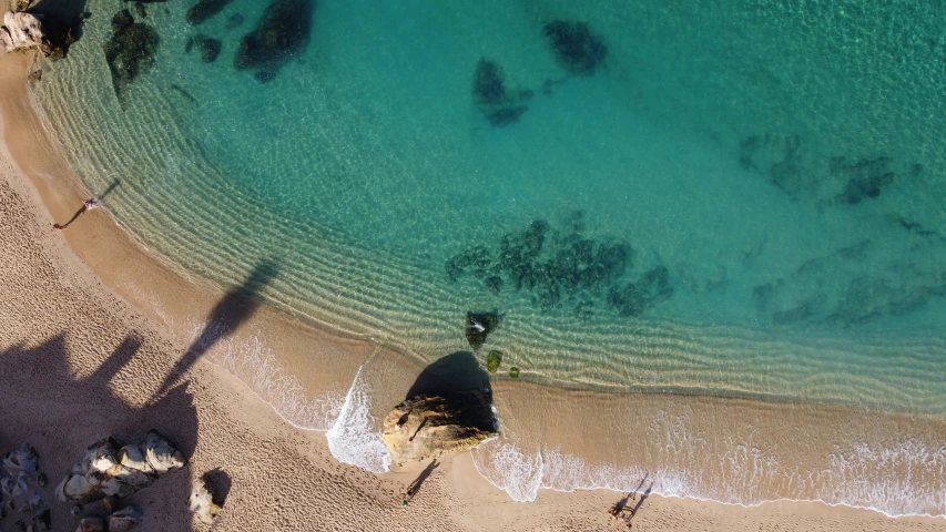 this aerial po shows the beautiful beach with clear blue water