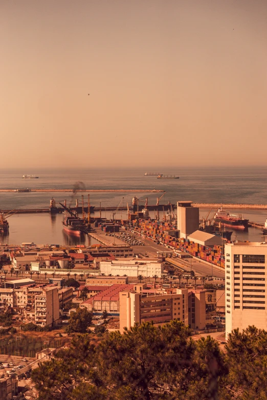 the port is busy with ships and cars in the bay