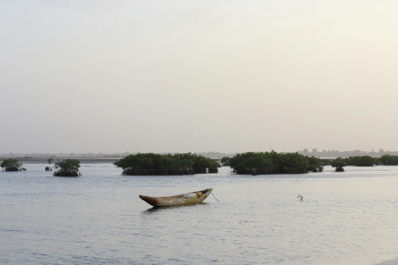 two boats in the water on the side of an ocean