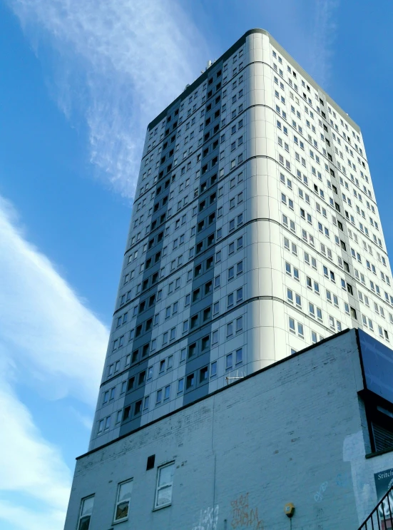 the very large tall white building has many windows