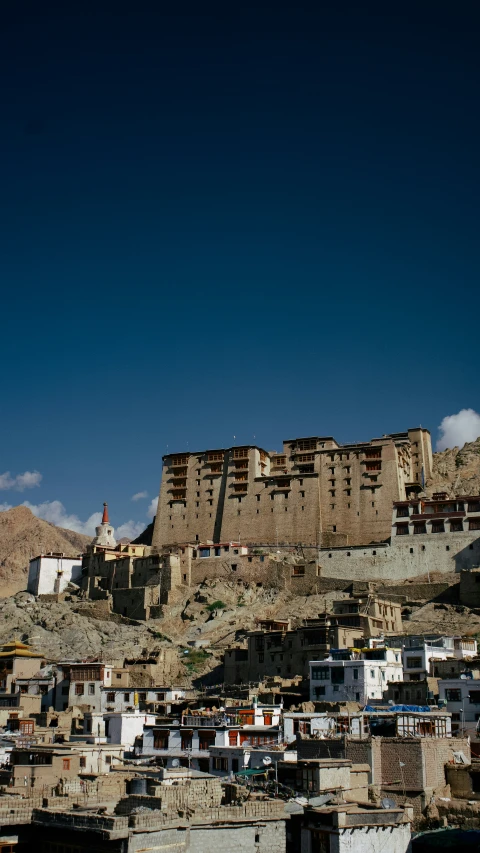 the view of buildings on the side of a mountain