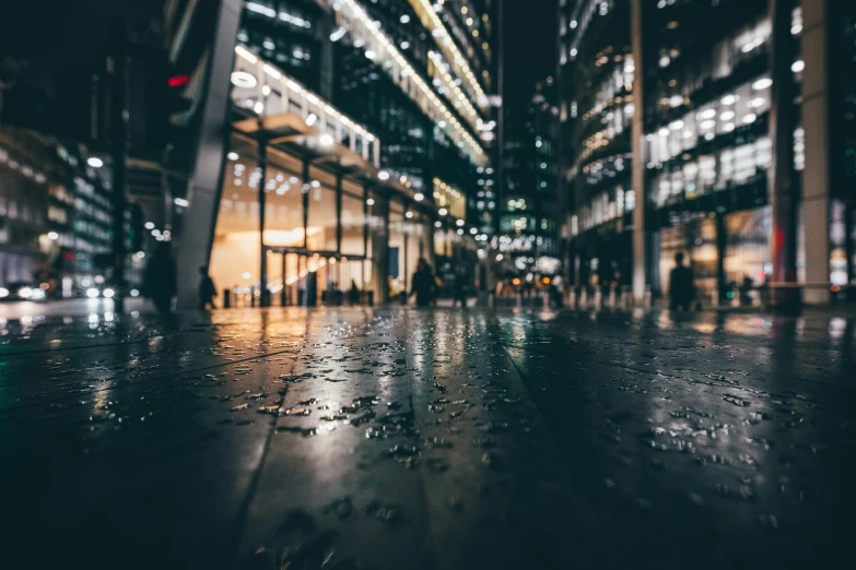 a blurry image of some buildings on a rainy night