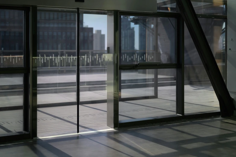 some very tall buildings with big windows and stairs