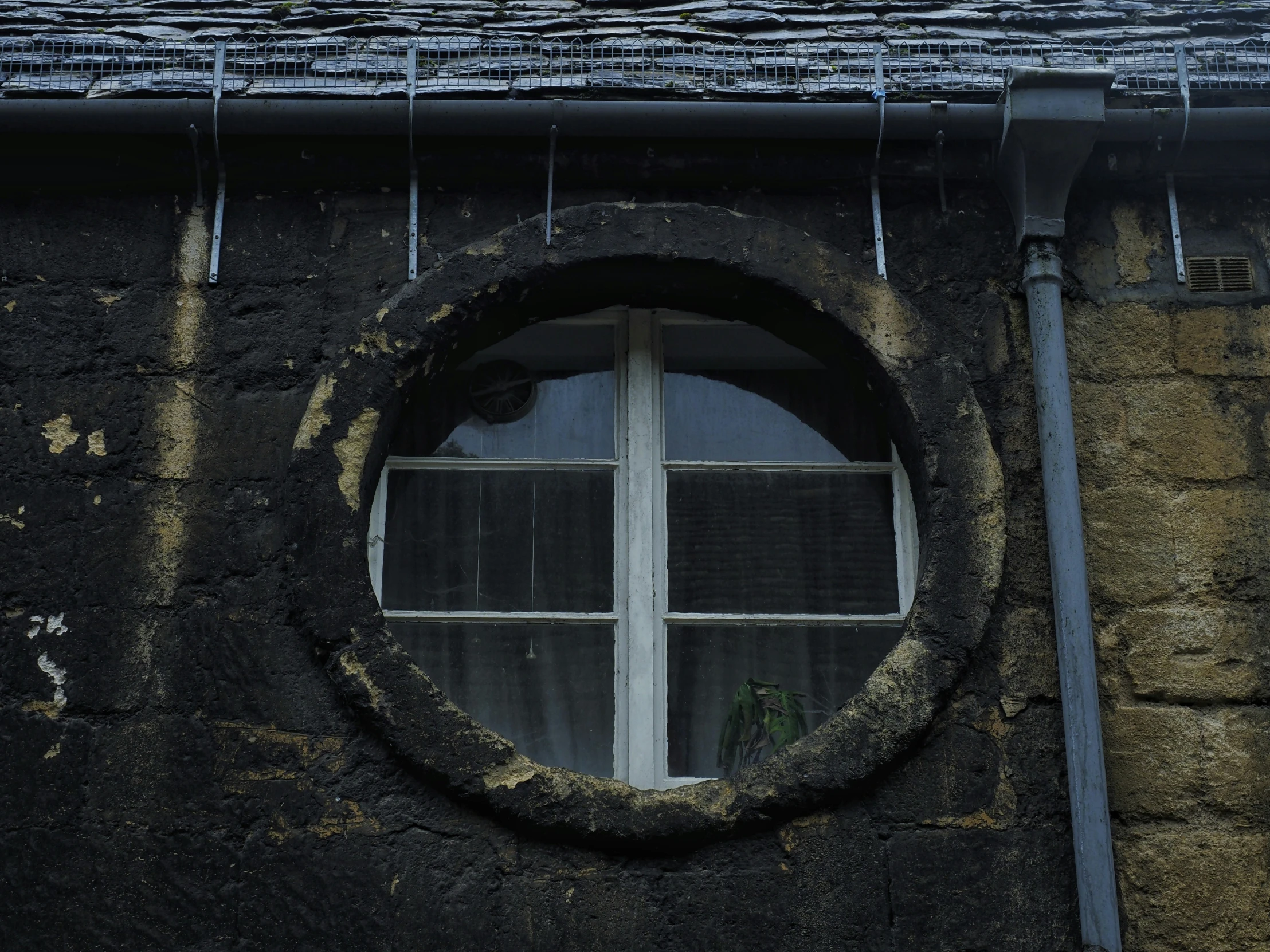 a view from a round window of the building