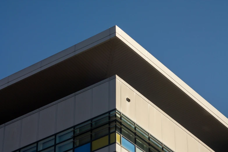 a large commercial plane flies past a large building