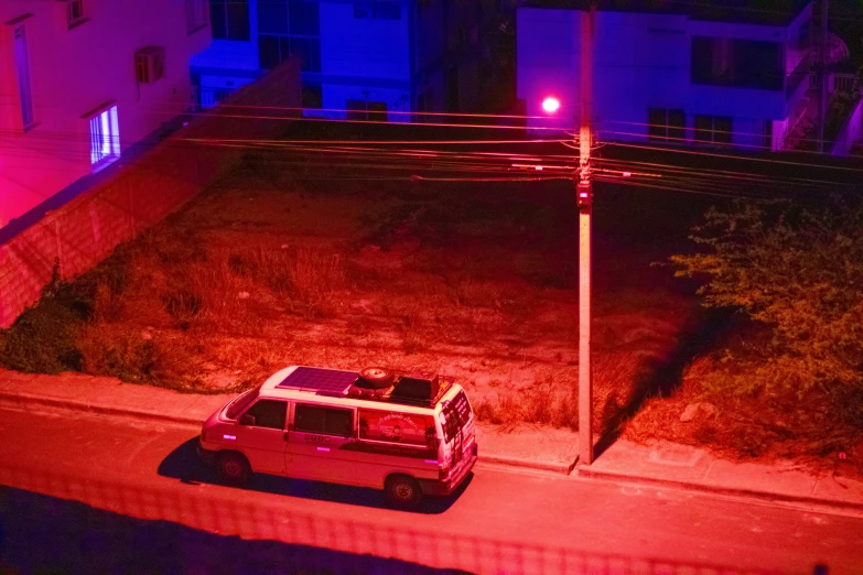 this is an aerial view of a vehicle parked along a side walk