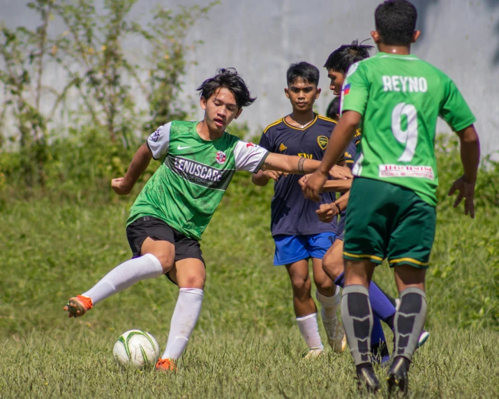 a young man getting ready to kick a soccer ball