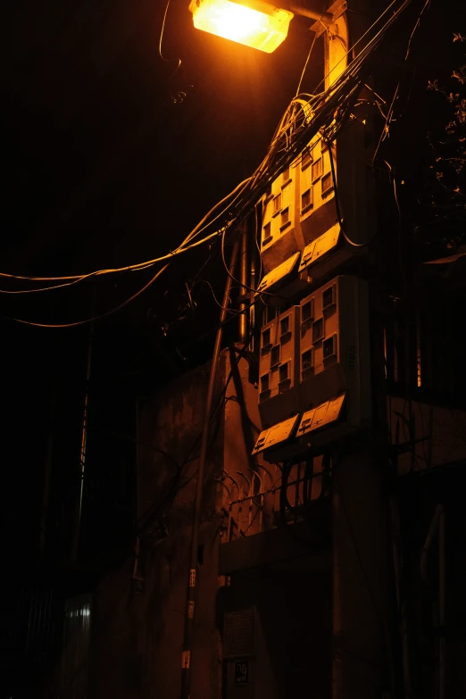 a street light shining at night on a building