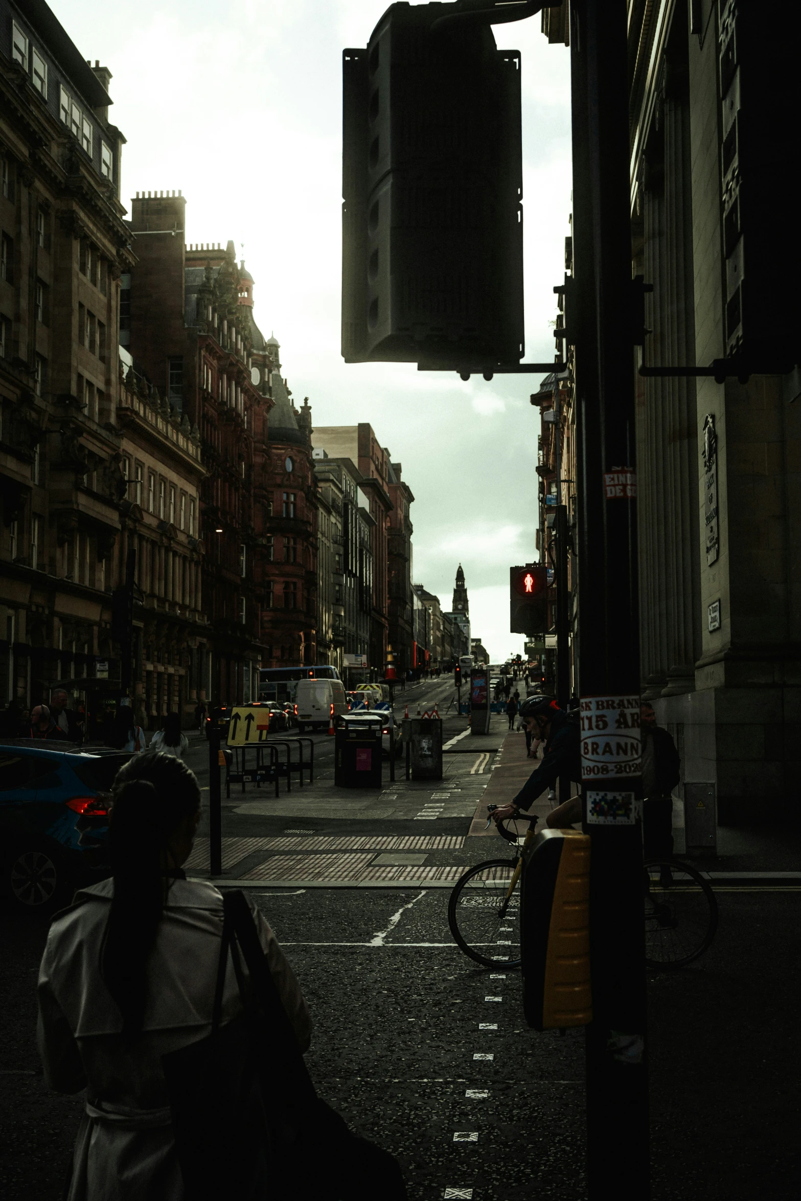 a city intersection has a stoplight and cars