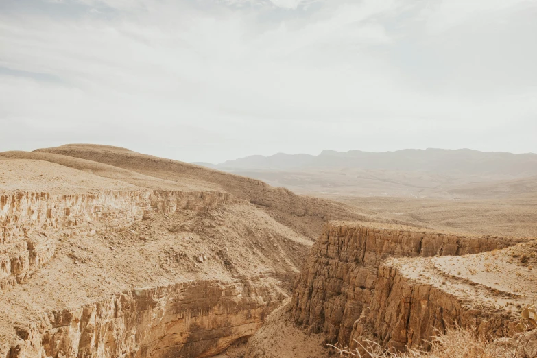 a mountain view in the desert showing steep, rock formations