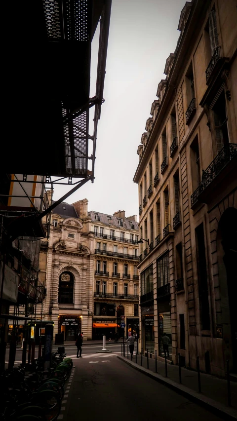 a person that is standing outside of a building