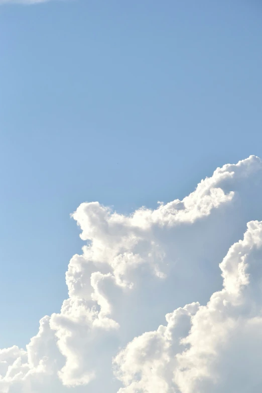 some white clouds and a blue sky