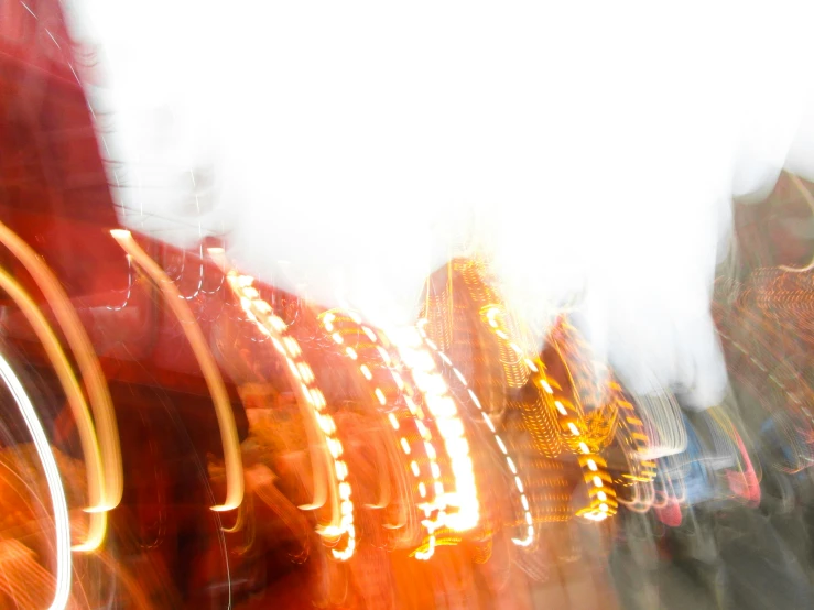 blurry pograph of a carnival ride with the lights on